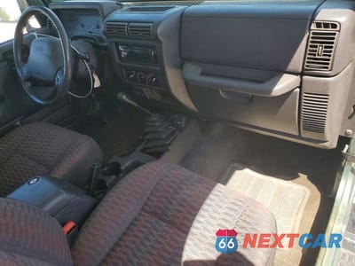 Zdjęcie 8 z 13 samochodu: 1999 JEEP WRANGLER / TJ SE VIN:1J4FY29PXXP436266 - miniatura