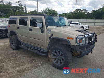 Czwarte zdjęcie samochodu z boku: 2003 HUMMER H2 VIN:5GRGN23UX3H145531 - miniatura