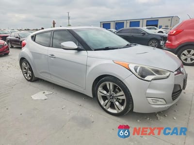 Czwarte zdjęcie samochodu z boku: 2014 HYUNDAI VELOSTER BASE VIN:KMHTC6AD3EU188582 - miniatura