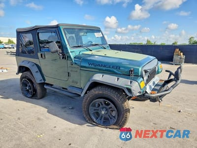 Czwarte zdjęcie samochodu z boku: 1999 JEEP WRANGLER / TJ SE VIN:1J4FY29P4XP460448 - miniatura
