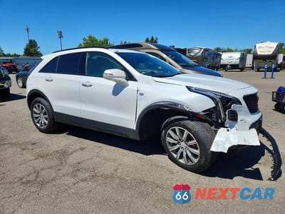 Czwarte zdjęcie samochodu z boku: 2021 CADILLAC XT4 SPORT VIN:1GYFZFR44MF001058 - miniatura