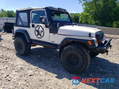 Czwarte zdjęcie samochodu z boku: 1998 JEEP WRANGLER VIN:1J4FY29P5WP765620 - miniatura