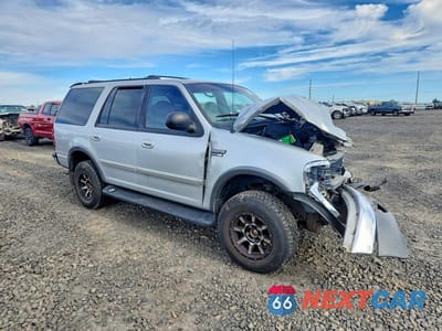 Czwarte zdjęcie samochodu z boku: 1999 FORD EXPEDITION VIN:1FMPU18L4XLA98851 - miniatura