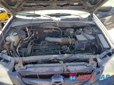 Zdjęcie 12 z 13 samochodu: 2004 MAZDA TRIBUTE DX VIN:4F2YZ02B34KM03925 - miniatura