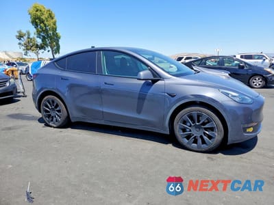 Czwarte zdjęcie samochodu z boku: 2022 TESLA MODEL Y VIN:7SAYGDEE9NF328488 - miniatura