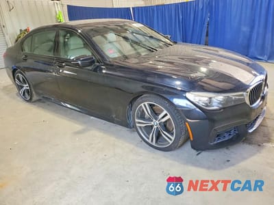 Czwarte zdjęcie samochodu z boku: 2016 BMW 740 I VIN:WBA7E2C58GG548104 - miniatura