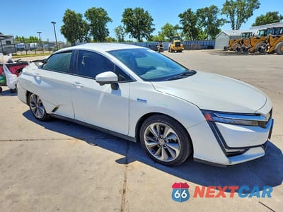 Czwarte zdjęcie samochodu z boku: 2021 HONDA CLARITY VIN:JHMZC5F11MC000409 - miniatura