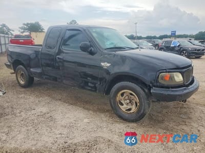 Czwarte zdjęcie samochodu z boku: 2003 FORD F150 VIN:1FTRX07253KC11407 - miniatura