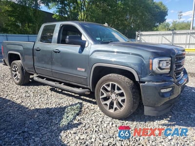 Czwarte zdjęcie samochodu z boku: 2017 GMC SIERRA K1500 SLT VIN:1GTV2NEC8HZ245653 - miniatura
