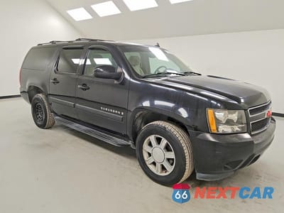 Czwarte zdjęcie samochodu z boku: 2007 CHEVROLET SUBURBAN C1500 VIN:1GNFC16037R216971 - miniatura