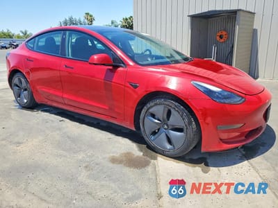 Czwarte zdjęcie samochodu z boku: 2022 TESLA MODEL 3 VIN:5YJ3E1EA6NF190675 - miniatura