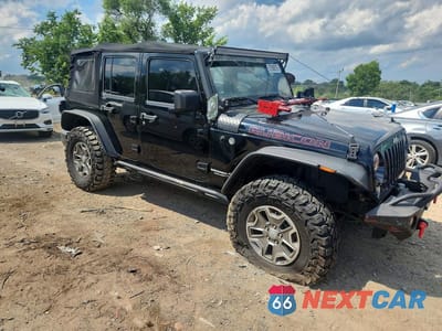 Czwarte zdjęcie samochodu z boku: 2015 JEEP WRANGLER UNLIMITED RUBICON VIN:1C4BJWFG3FL606073 - miniatura