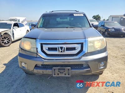 Piąte zdjęcie samochodu w środku: 2011 HONDA PILOT EXLN VIN:5FNYF4H72BB014948 - miniatura