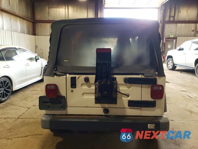 Zdjęcie 6 z 12 samochodu: 2004 JEEP WRANGLER VIN:1J4FA29104P787120 - miniatura
