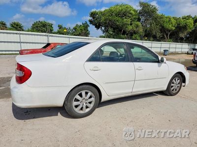 Trzecie zdjęcie samochodu z tyłu: 2002 TOYOTA CAMRY XLE V6 VIN:JTDBF30K720019478 - miniatura