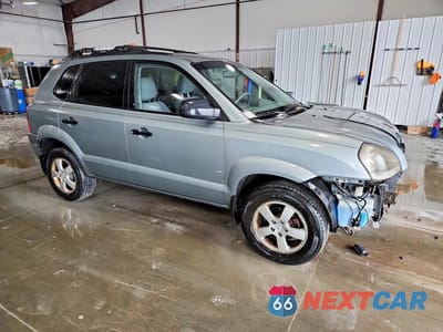 Czwarte zdjęcie samochodu z boku: 2006 HYUNDAI TUCSON GL VIN:KM8JM12B06U482625 - miniatura