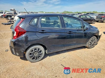 Trzecie zdjęcie samochodu z tyłu: 2016 HONDA FIT LX VIN:JHMGK5H59GX011343 - miniatura