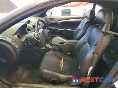 Zdjęcie 7 z 12 samochodu: 2003 MITSUBISHI ECLIPSE SPYDER GS VIN:4A3AE45GX3E202545 - miniatura
