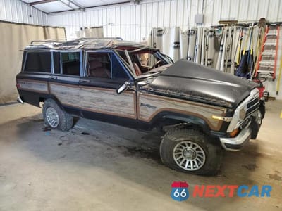 Czwarte zdjęcie samochodu z boku: 1988 JEEP GRAND WAGONEER VIN:1JCNJ15U7JT193363 - miniatura