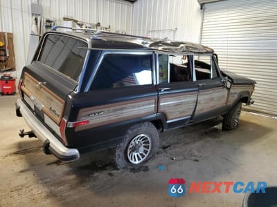 Trzecie zdjęcie samochodu z tyłu: 1988 JEEP GRAND WAGONEER VIN:1JCNJ15U7JT193363 - miniatura