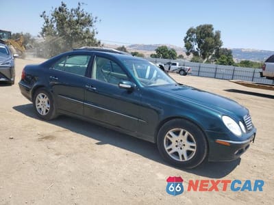 Czwarte zdjęcie samochodu z boku: 2003 MERCEDES-BENZ E 320 VIN:WDBUF65J73A179106 - miniatura