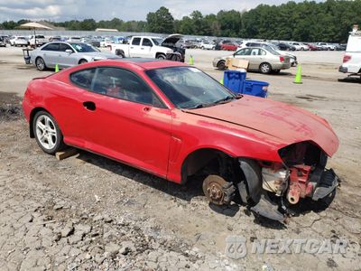 Czwarte zdjęcie samochodu z boku: 2004 HYUNDAI TIBURON GT VIN:KMHHN65F64U146613 - miniatura