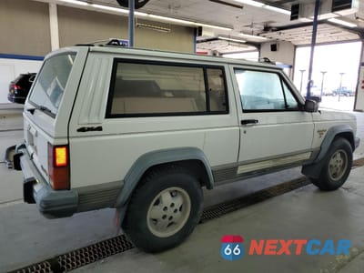 Trzecie zdjęcie samochodu z tyłu: 1990 JEEP CHEROKEE LAREDO VIN:1J4FJ57L1LL166898 - miniatura