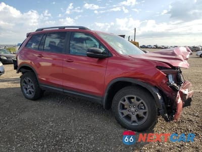 Czwarte zdjęcie samochodu z boku: 2024 HONDA PASSPORT TRAIL SPORT VIN:5FNYF8H6XRB008386 - miniatura