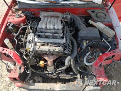 Zdjęcie 11 z 13 samochodu: 2004 HYUNDAI TIBURON GT VIN:KMHHN65F64U146613 - miniatura