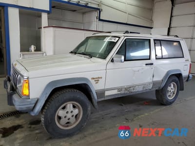 1990 JEEP CHEROKEE LAREDO 1J4FJ57L1LL166898 - główne zdjęcie licytacji z USA - miniatura