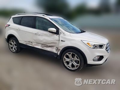 Czwarte zdjęcie samochodu z boku: 2017 FORD ESCAPE TITANIUM VIN:1FMCU0J94HUD34529 - miniatura