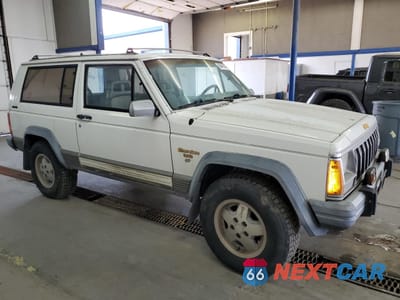 Czwarte zdjęcie samochodu z boku: 1990 JEEP CHEROKEE LAREDO VIN:1J4FJ57L1LL166898 - miniatura