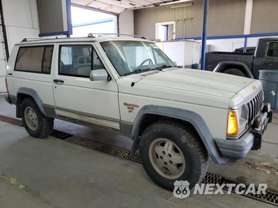 Czwarte zdjęcie samochodu z boku: 1990 JEEP CHEROKEE LAREDO VIN:1J4FJ57L1LL166898 - miniatura