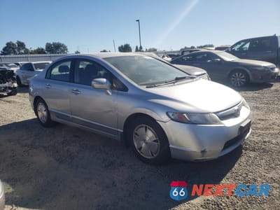 Czwarte zdjęcie samochodu z boku: 2006 HONDA CIVIC HYBRID VIN:JHMFA362X6S028689 - miniatura