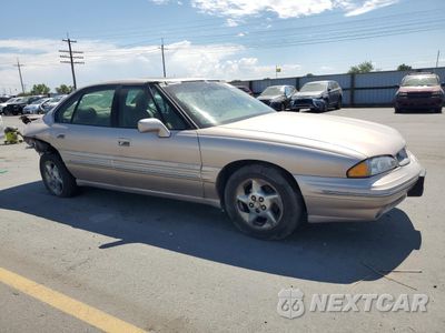Czwarte zdjęcie samochodu z boku: 1999 PONTIAC BONNEVILLE SE VIN:1G2HX52K1XH233699 - miniatura