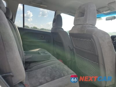 Zdjęcie 11 z 13 samochodu: 2004 HONDA PILOT EX VIN:2HKYF18434H541437 - miniatura