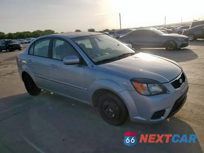 Czwarte zdjęcie samochodu z boku: 2010 KIA RIO LX VIN:KNADH4A3XA6673089 - miniatura
