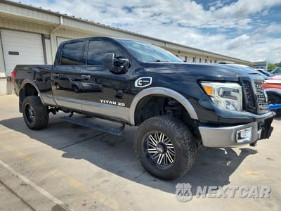 Czwarte zdjęcie samochodu z boku: 2017 NISSAN TITAN XD SL VIN:1N6BA1F44HN511180 - miniatura