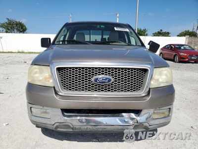 Piąte zdjęcie samochodu w środku: 2004 FORD F150 VIN:1FTPX12574NA28587 - miniatura
