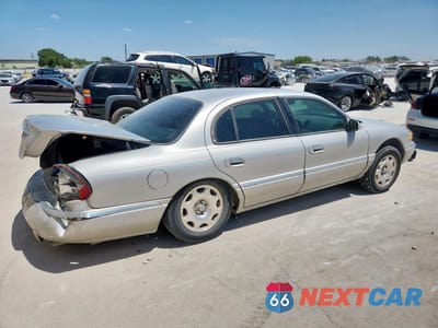 Trzecie zdjęcie samochodu z tyłu: 2002 LINCOLN CONTINENTAL VIN:1LNHM97V72Y693131 - miniatura