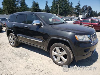 Czwarte zdjęcie samochodu z boku: 2013 JEEP GRAND CHEROKEE OVERLAND VIN:1C4RJFCG3DC609619 - miniatura