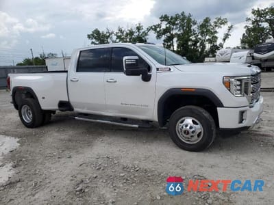 Czwarte zdjęcie samochodu z boku: 2022 GMC SIERRA K3500 DENALI VIN:1GT49WEY9NF260961 - miniatura