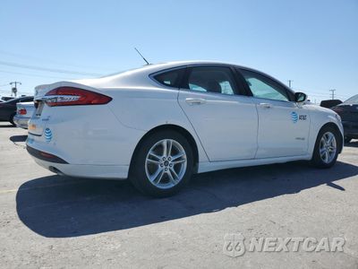 Trzecie zdjęcie samochodu z tyłu: 2018 FORD FUSION SE HYBRID VIN:3FA6P0LU7JR171615 - miniatura
