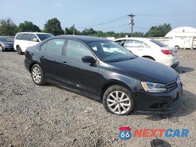 Czwarte zdjęcie samochodu z boku: 2015 VOLKSWAGEN JETTA SE VIN:3VWD17AJ3FM247319 - miniatura