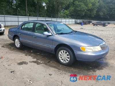 Czwarte zdjęcie samochodu z boku: 1999 LINCOLN CONTINENTAL VIN:1LNHM97V4XY610195 - miniatura