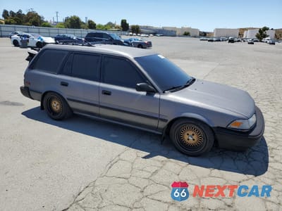 Czwarte zdjęcie samochodu z boku: 1991 TOYOTA COROLLA DLX VIN:JT2AE94K1M3460304 - miniatura