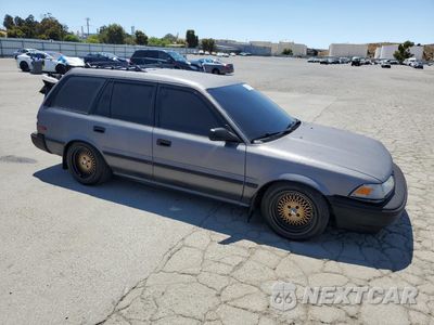 Czwarte zdjęcie samochodu z boku: 1991 TOYOTA COROLLA DLX VIN:JT2AE94K1M3460304 - miniatura