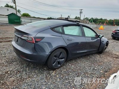 Trzecie zdjęcie samochodu z tyłu: 2023 TESLA MODEL 3 VIN:5YJ3E1EA2PF422028 - miniatura