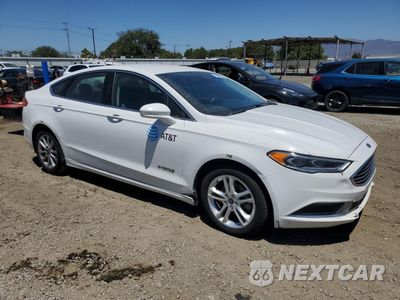 Czwarte zdjęcie samochodu z boku: 2018 FORD FUSION SE HYBRID VIN:3FA6P0LUXJR118763 - miniatura