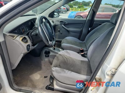 Zdjęcie 7 z 14 samochodu: 2004 FORD FOCUS LX VIN:1FAFP33P84W191529 - miniatura